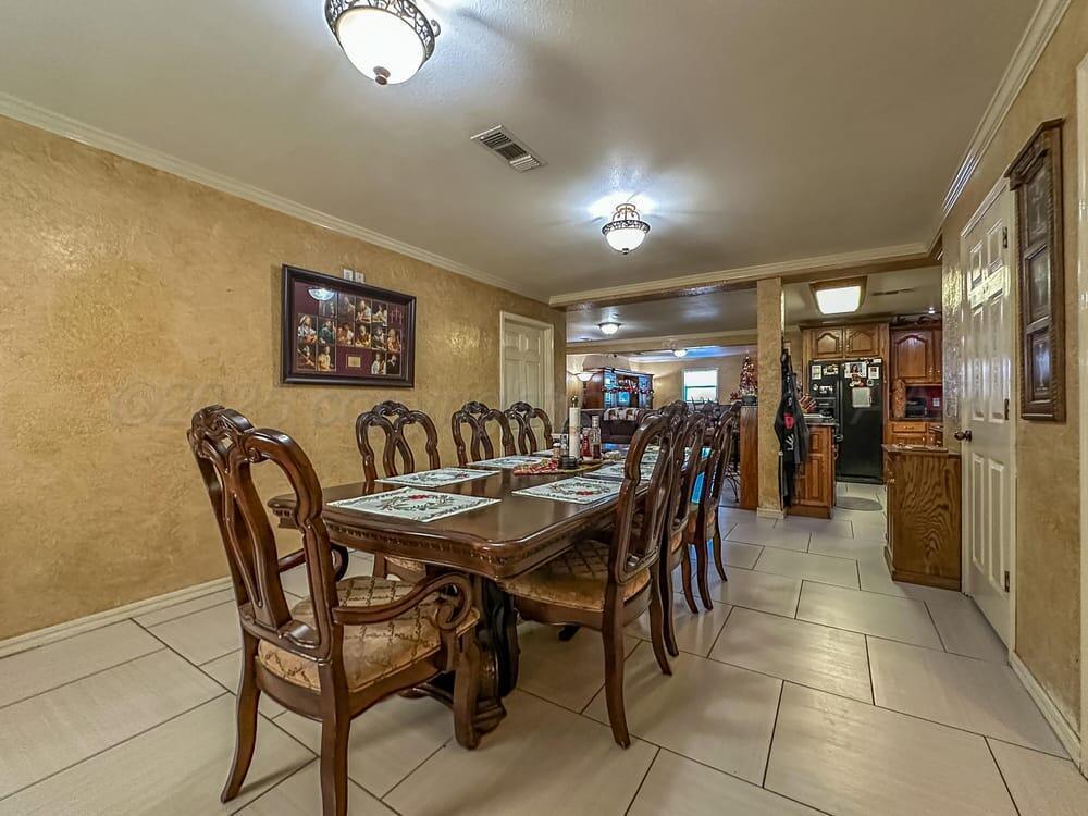 204 Garrett Street Borger, TX 79007 - Photo 11 of 23 a dining area with furniture and chandelier