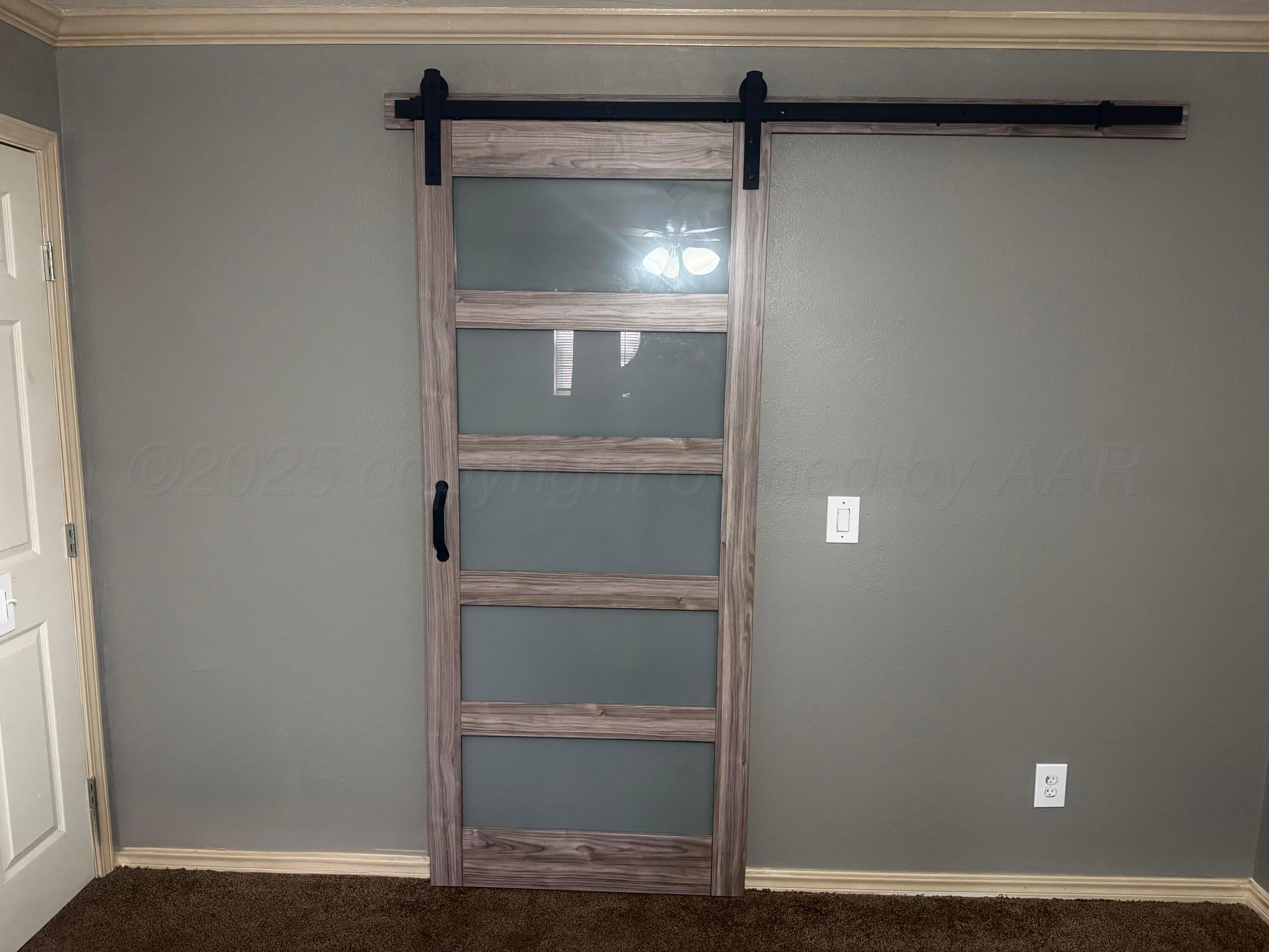 204 Garrett Street Borger, TX 79007 - Photo 14 of 23 a view of room with wooden floor