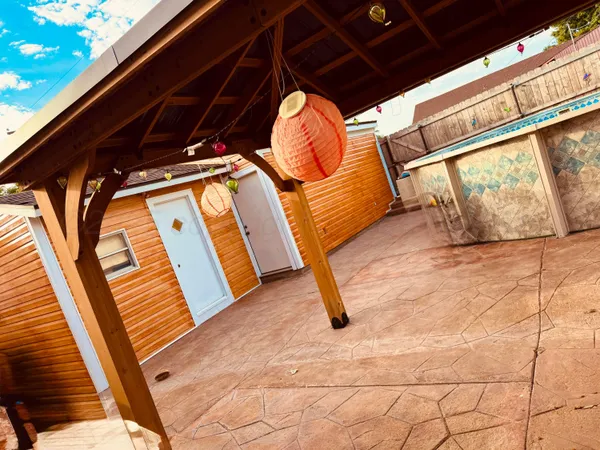 a view of outdoor space with wooden floor and shower