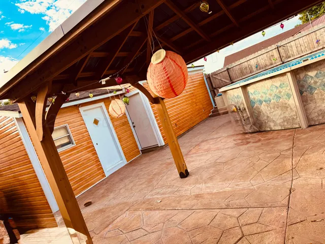 a view of outdoor space with wooden floor and shower