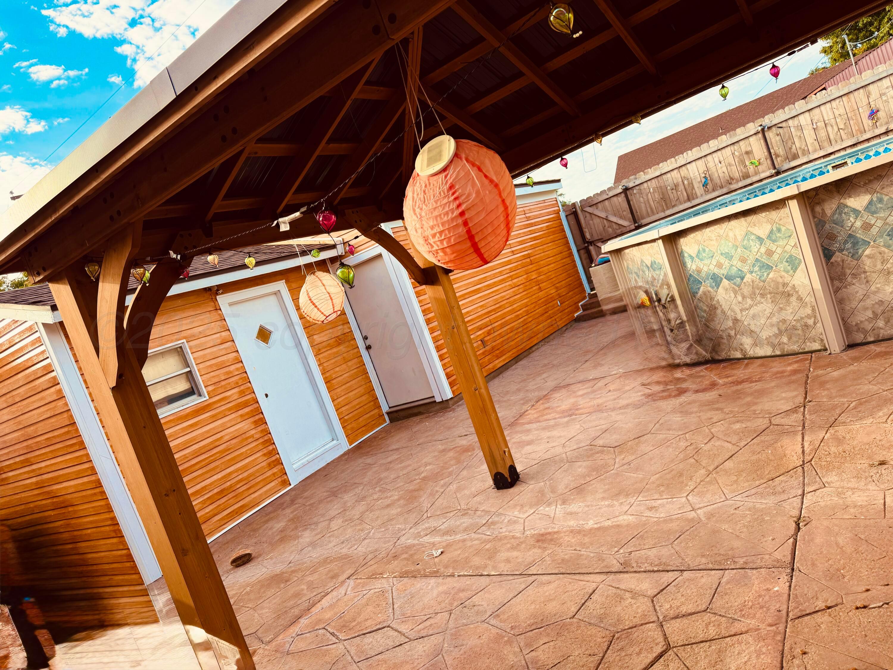 204 Garrett Street Borger, TX 79007 - Photo 21 of 23 a view of outdoor space with wooden floor and shower
