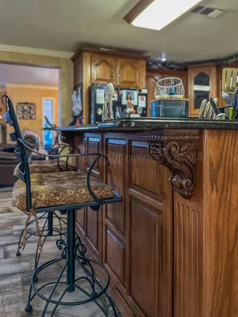 a view of a chairs and table in a kitchen