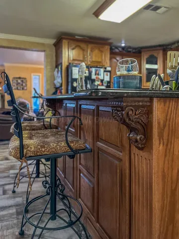 a view of a chairs and table in a kitchen