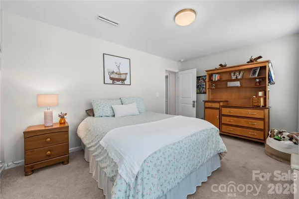 a bedroom with a bed and a closet