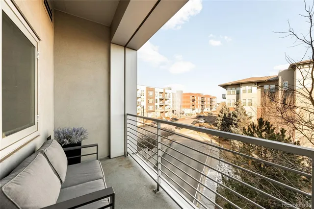 a view of a balcony with furniture