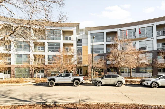 a view of a cars parked in front of a building