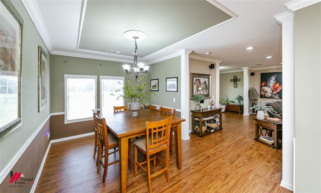 12501 Rust Lane Keithville, LA 71047 - Photo 11 of 39 a view of a dining room with furniture and wooden floor