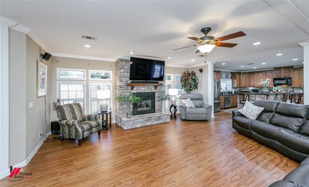 12501 Rust Lane Keithville, LA 71047 - Photo 13 of 39 a living room with furniture flat screen tv and wooden floor