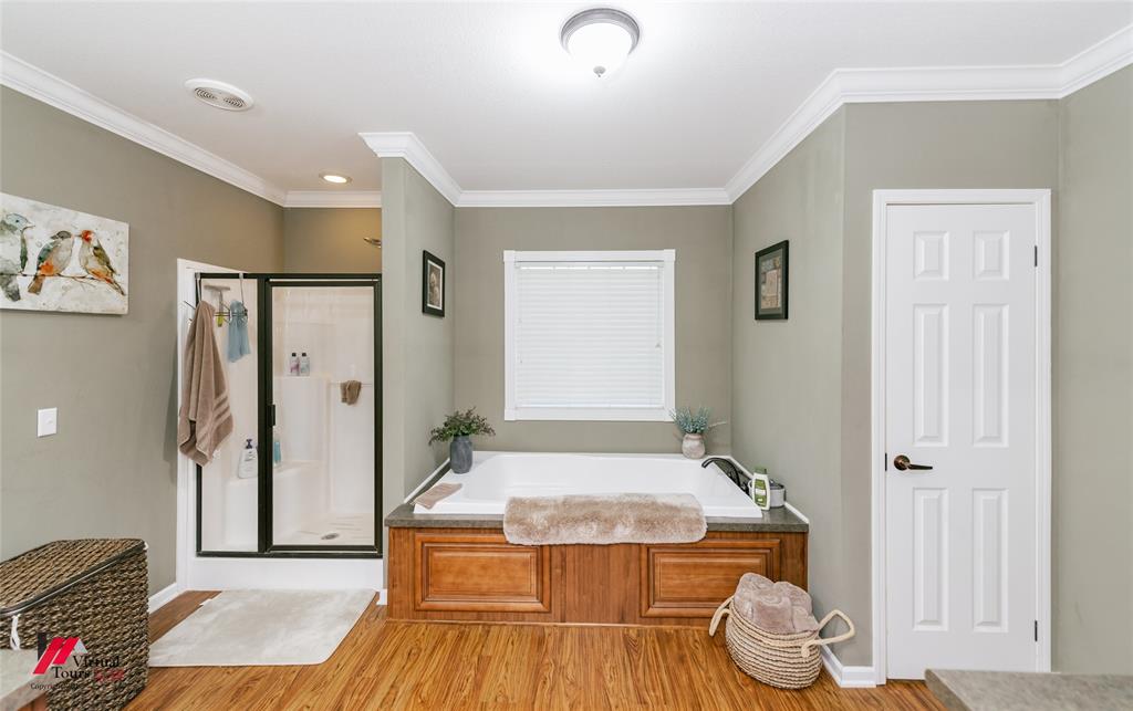 12501 Rust Lane Keithville, LA 71047 - Photo 21 of 39 a view of bathroom with shower and wooden floor