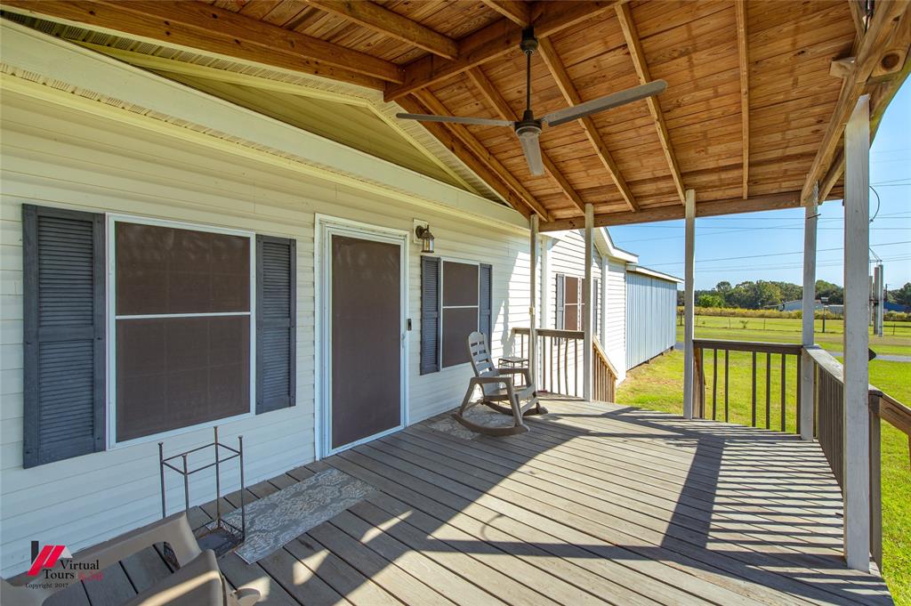 12501 Rust Lane Keithville, LA 71047 - Photo 37 of 39 a view of a patio with a table and chairs