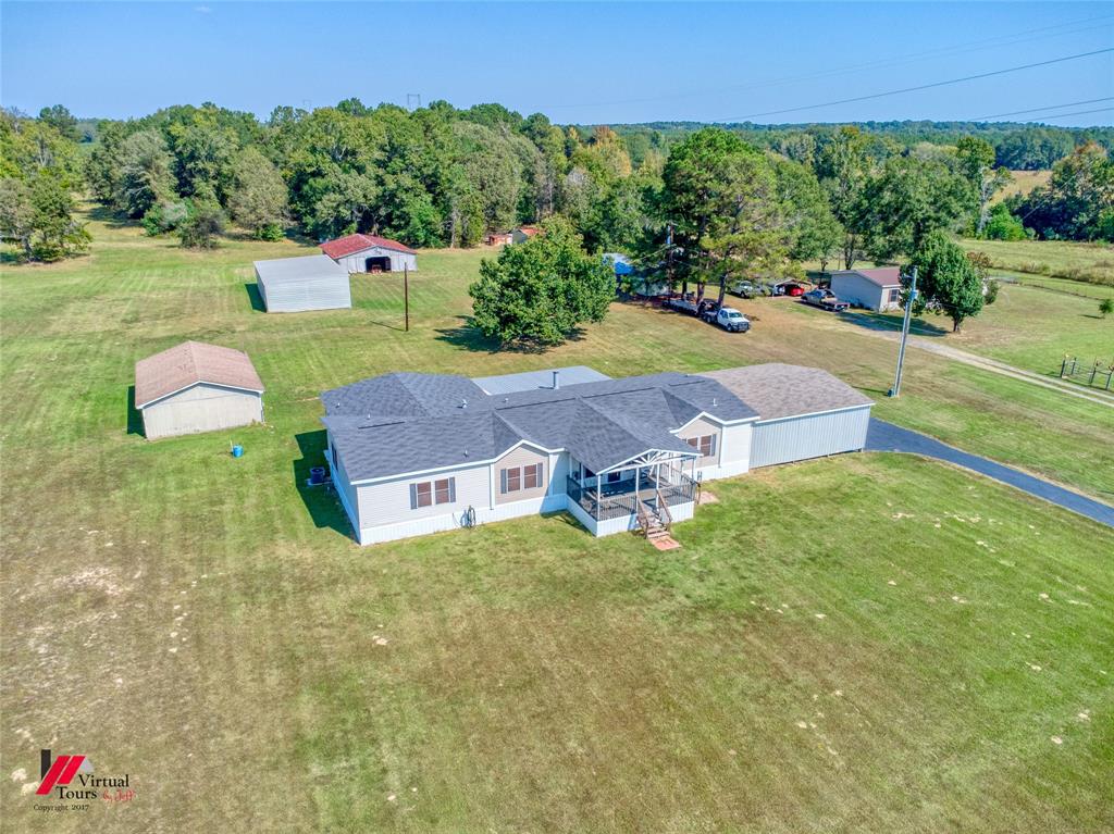 12501 Rust Lane Keithville, LA 71047 - Photo 4 of 39 a aerial view of a house with garden space and street view