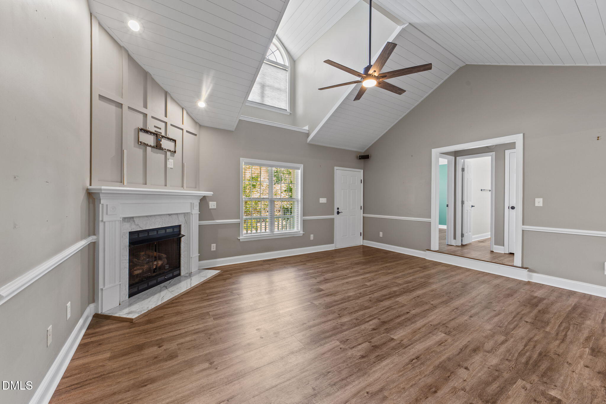 6820 Oviedo Drive Raleigh, NC 27603 - Photo 17 of 50 wooden floor fireplace and windows in an empty room