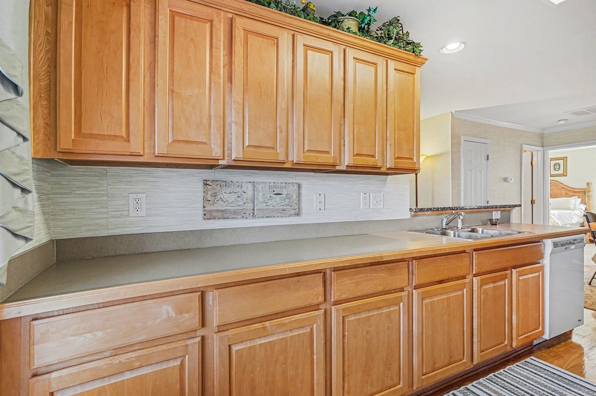 3425 Arrowhead Boulevard Myrtle Beach, SC 29579 - Photo 11 of 38 Kitchen with dishwasher, light countertops, ornamental molding, and recessed lighting