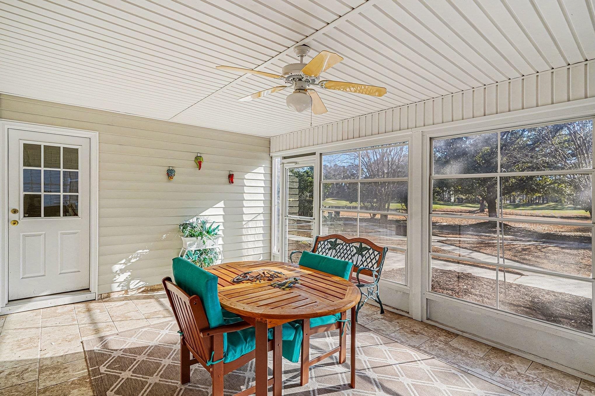 3425 Arrowhead Boulevard Myrtle Beach, SC 29579 - Photo 13 of 38 Sunroom / solarium featuring outdoor dining area and ceiling fan