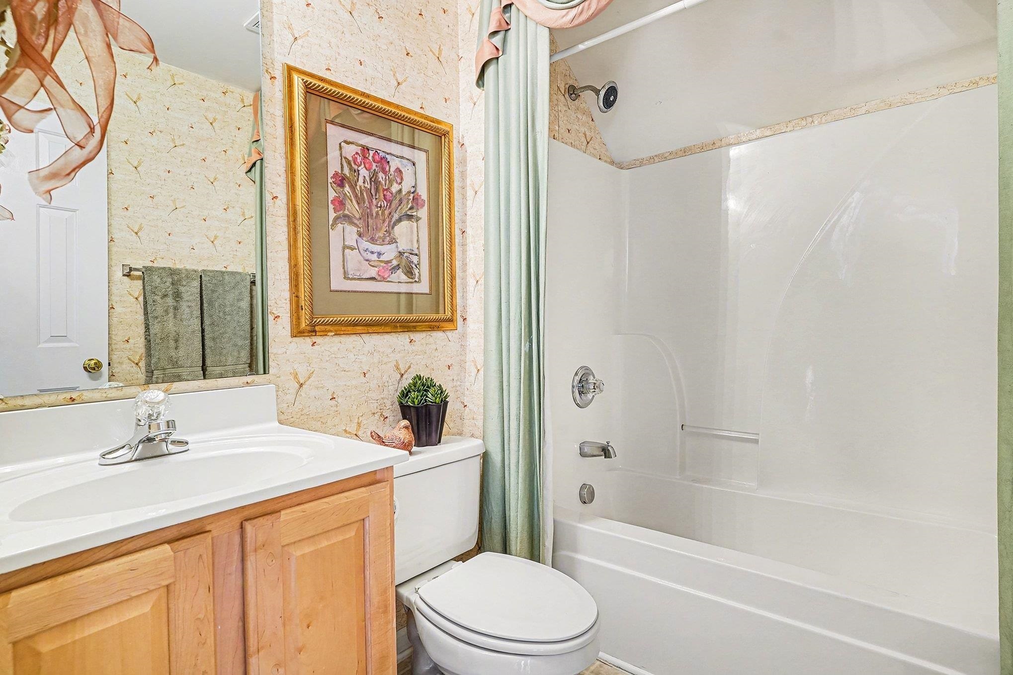 3425 Arrowhead Boulevard Myrtle Beach, SC 29579 - Photo 17 of 38 Bathroom with vanity and shower / bathtub combination with curtain