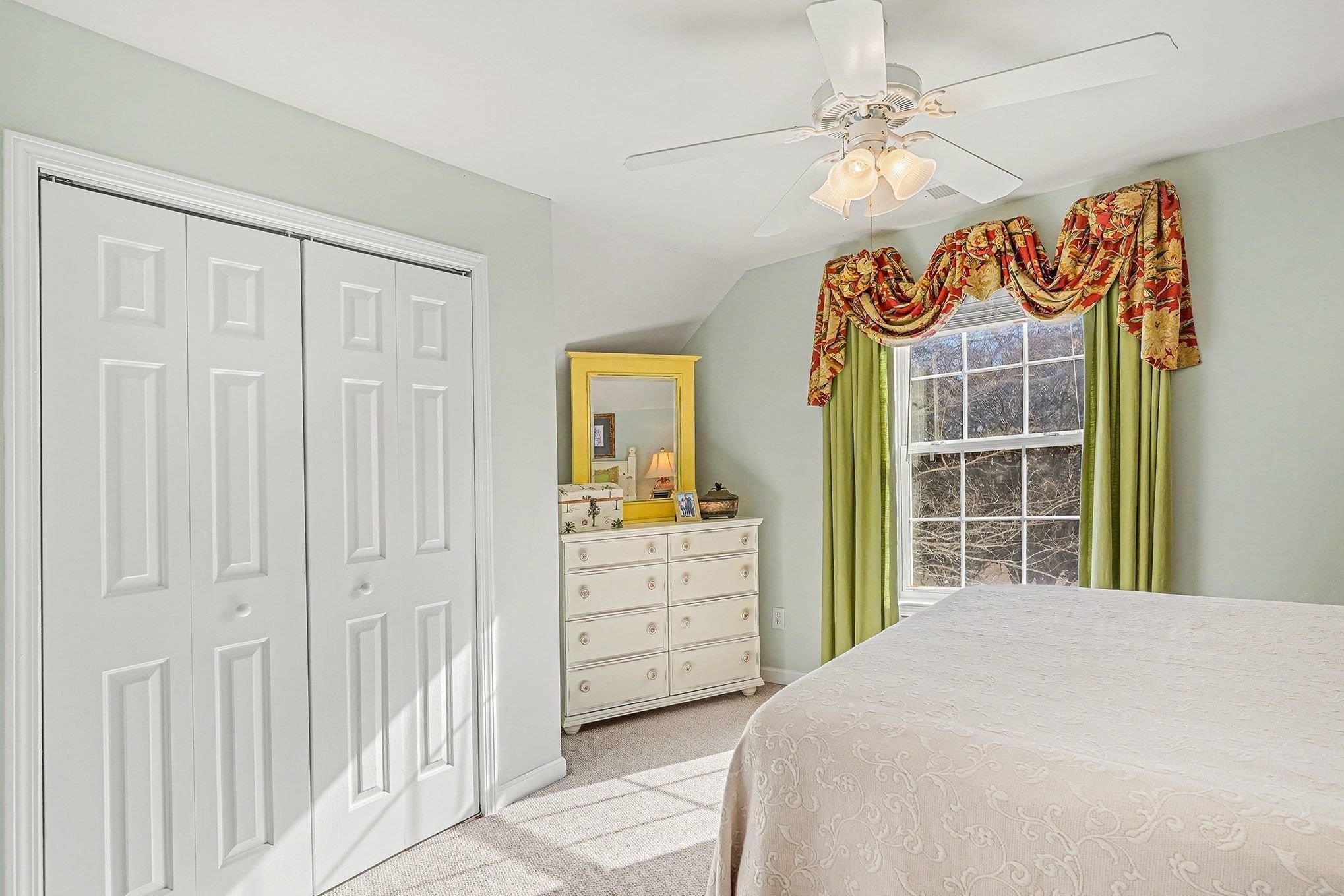 3425 Arrowhead Boulevard Myrtle Beach, SC 29579 - Photo 25 of 38 Bedroom featuring light colored carpet, ceiling fan, vaulted ceiling, and a closet