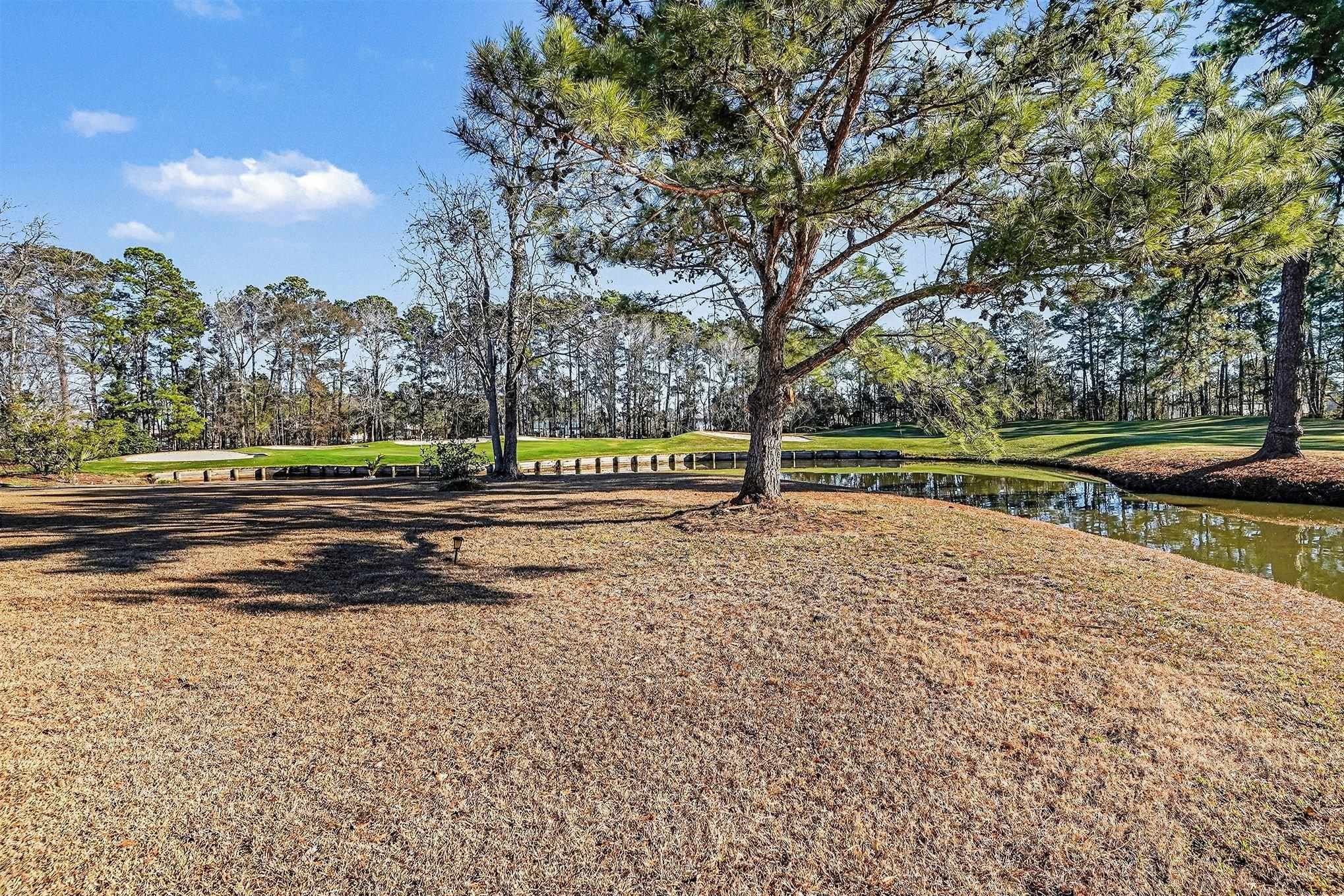 3425 Arrowhead Boulevard Myrtle Beach, SC 29579 - Photo 46 of 51 Surrounding community featuring a water view, view of wooded area, and a lawn