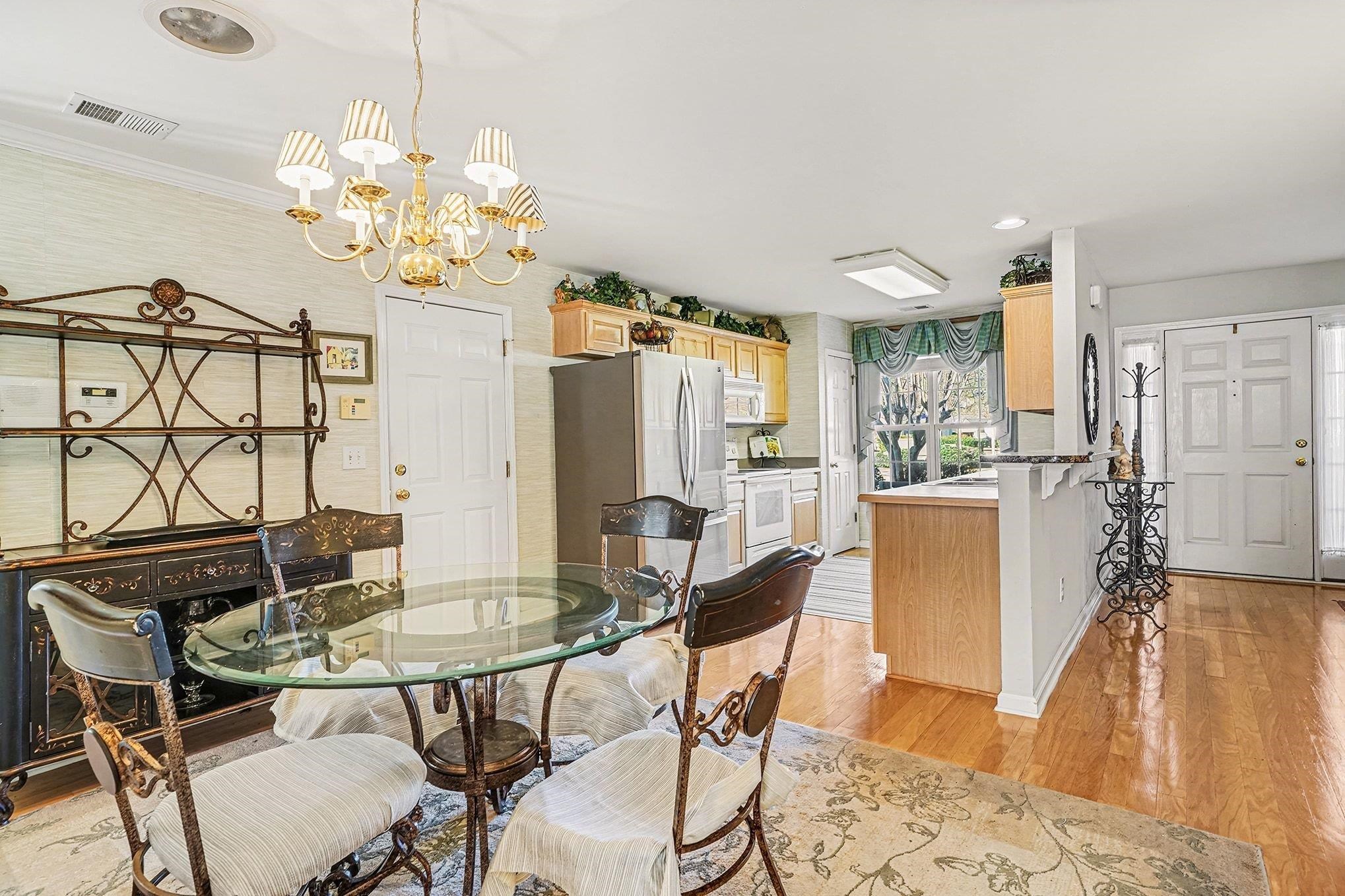 3425 Arrowhead Boulevard Myrtle Beach, SC 29579 - Photo 8 of 38 Dining room with light wood-type flooring and a chandelier