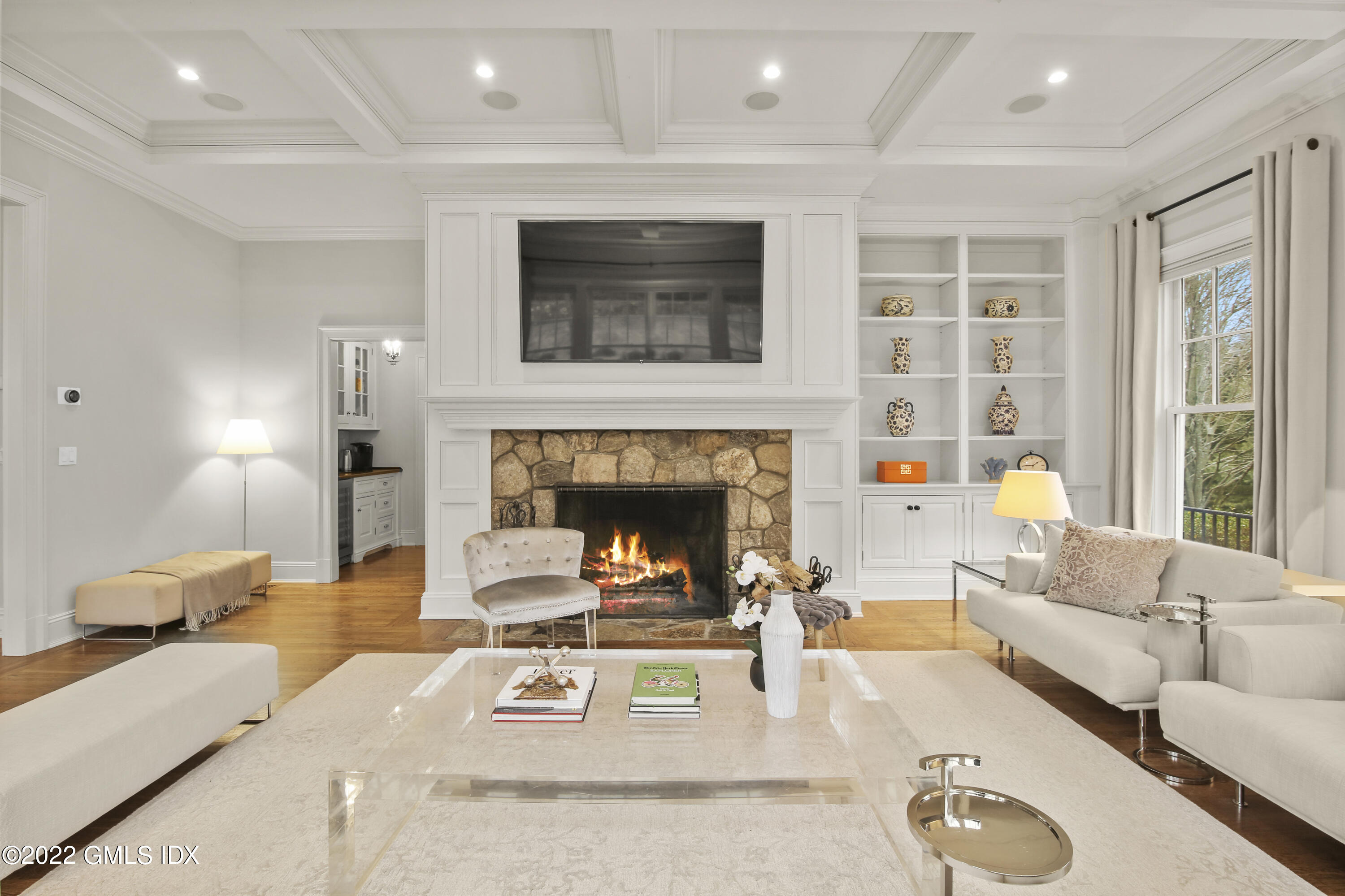 807 Lake Avenue Greenwich, CT 06830 - Photo 11 of 31 a living room with furniture and a fireplace