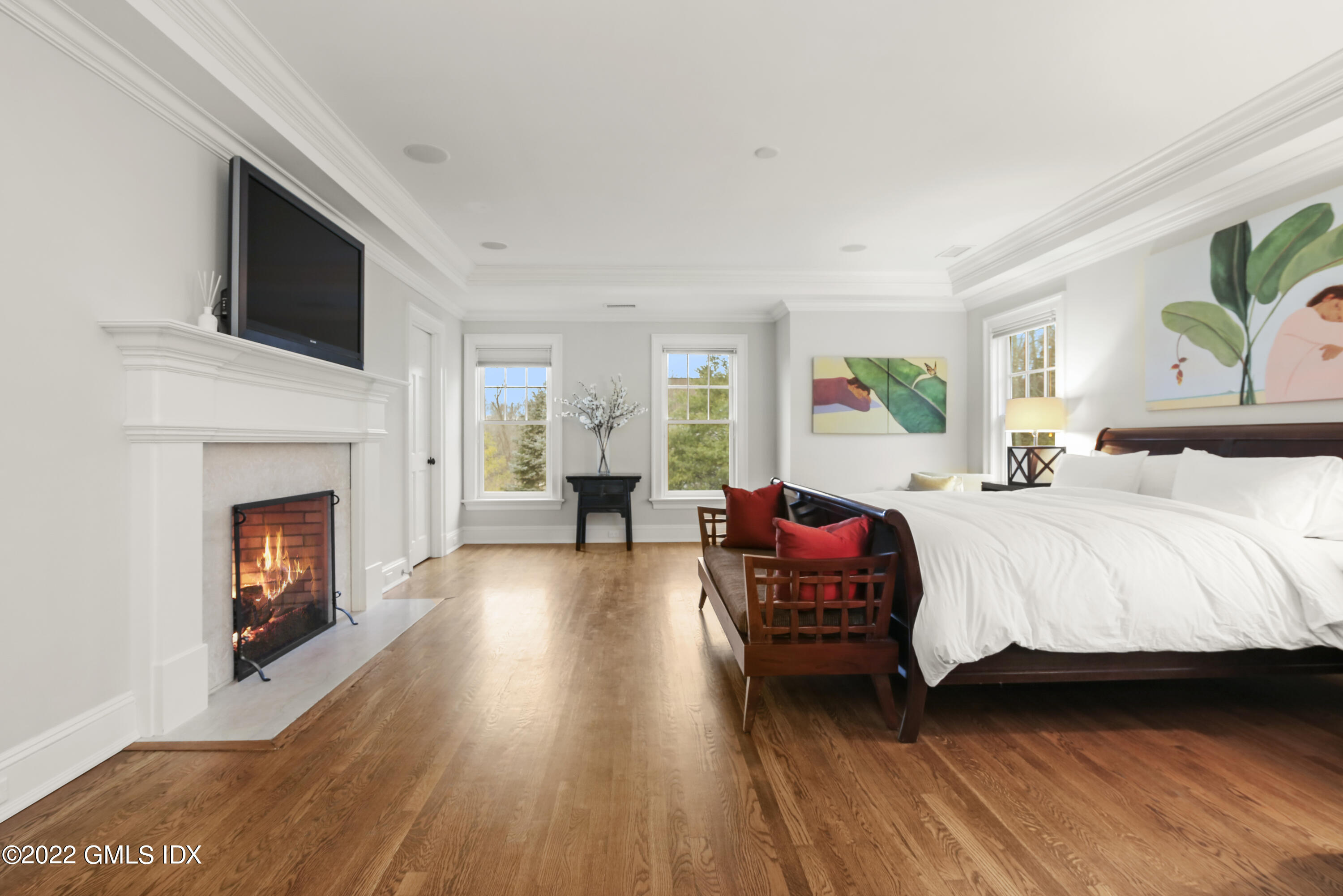 807 Lake Avenue Greenwich, CT 06830 - Photo 14 of 31 a bedroom with a bed and a fireplace
