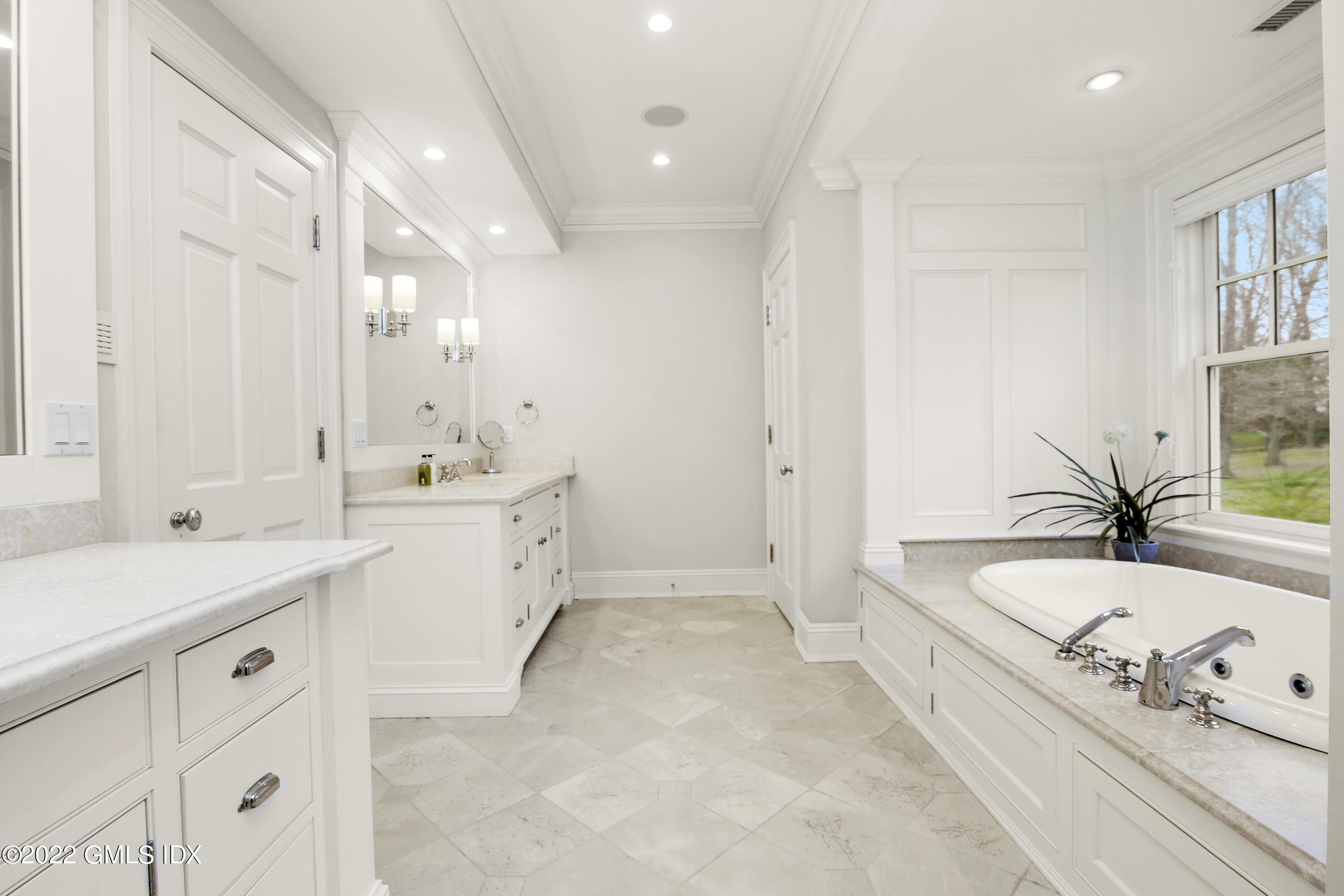 807 Lake Avenue Greenwich, CT 06830 - Photo 15 of 31 a large white bathroom with a granite countertop double vanity sink a mirror and a bathtub