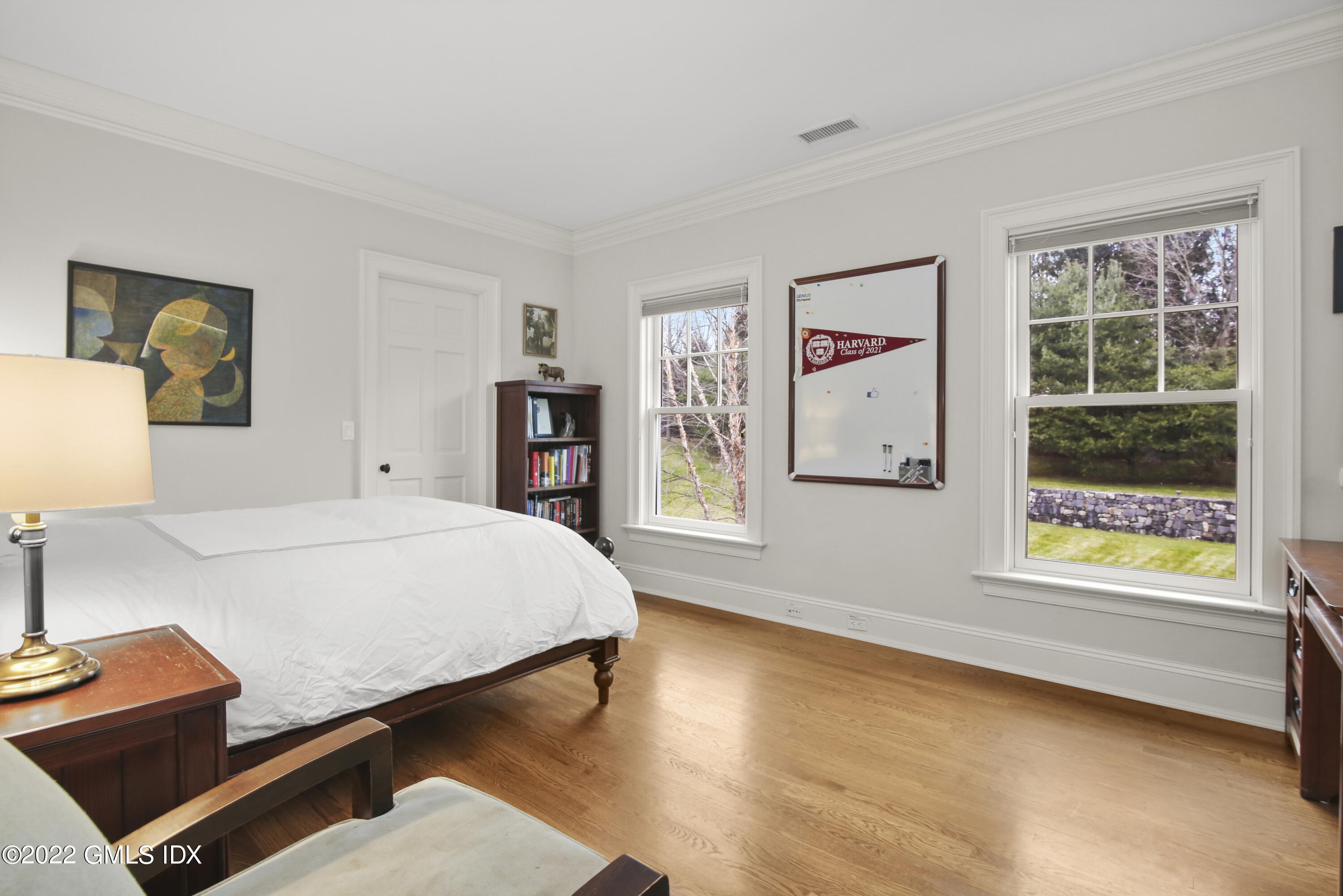 807 Lake Avenue Greenwich, CT 06830 - Photo 18 of 31 a bedroom with a bed and wooden floor