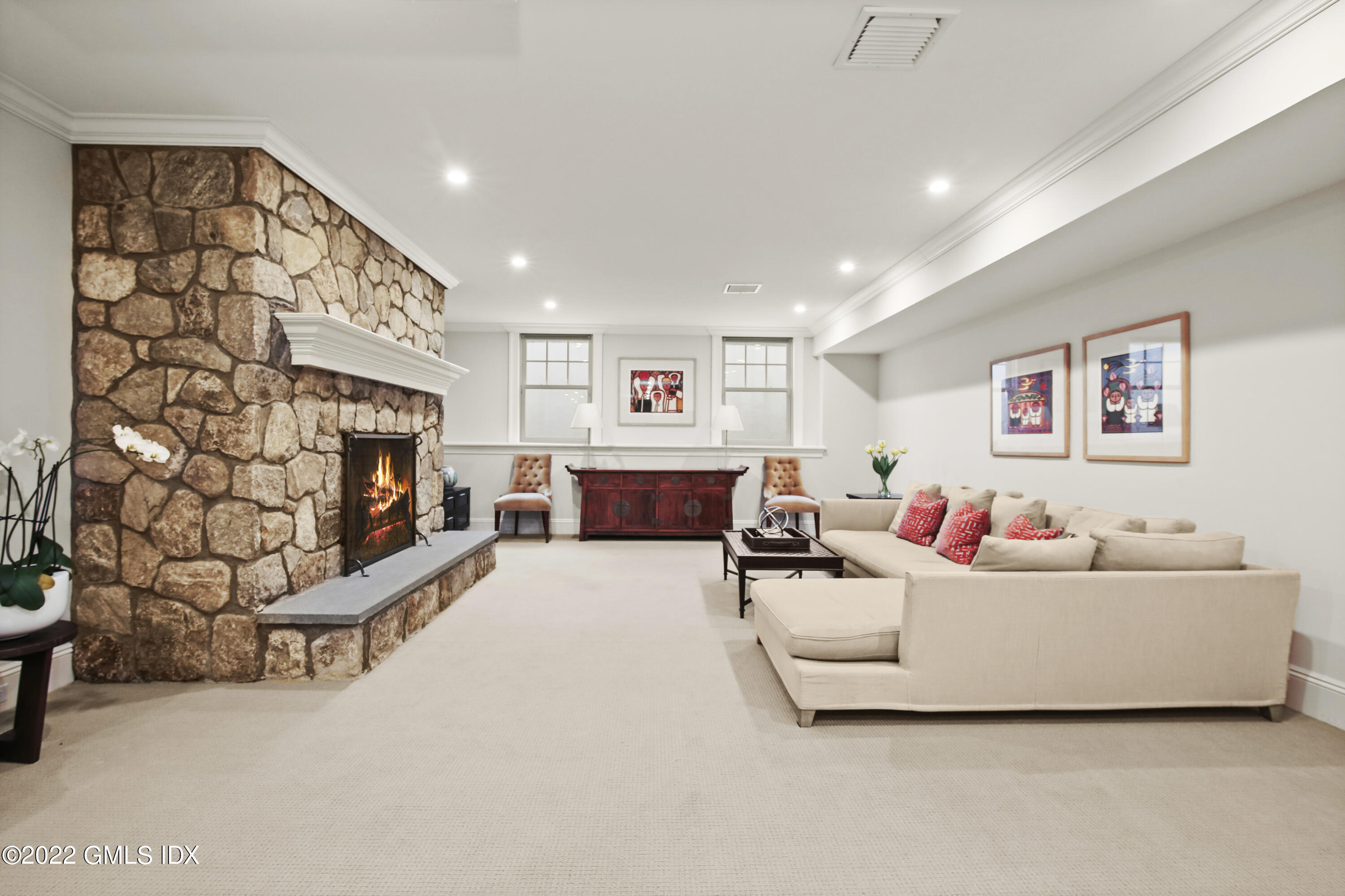 807 Lake Avenue Greenwich, CT 06830 - Photo 22 of 31 a living room with furniture and a flat screen tv