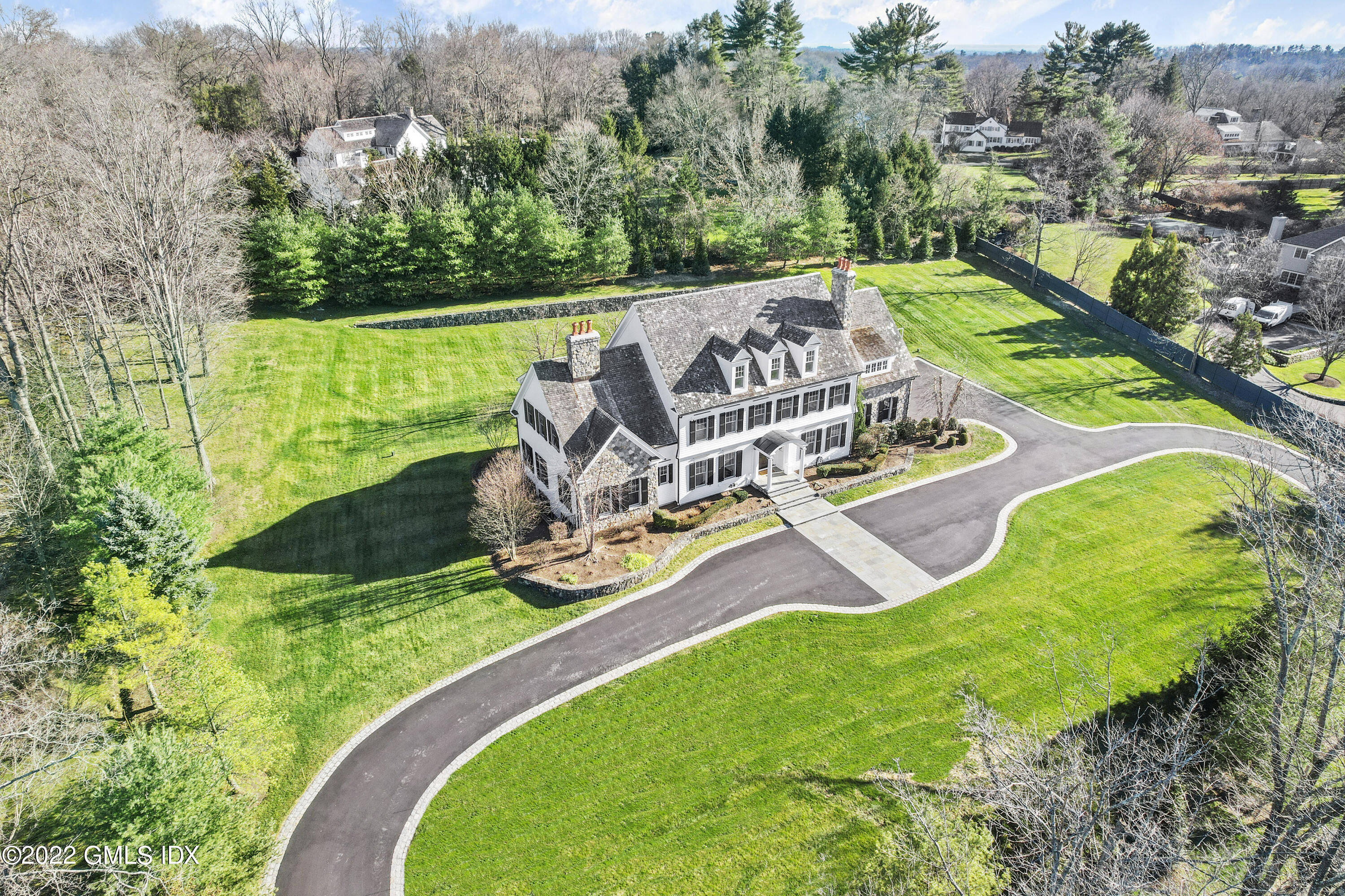 807 Lake Avenue Greenwich, CT 06830 - Photo 27 of 31 an aerial view of a garden with lawn chairs