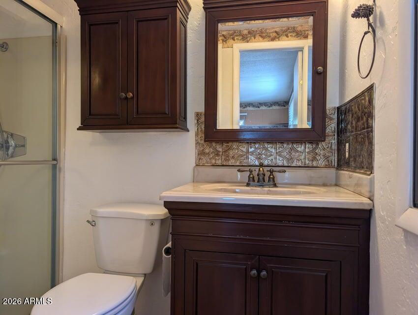908 North Matterhorn Road Payson, AZ 85541 - Photo 36 of 59 a bathroom with a sink vanity and toilet
