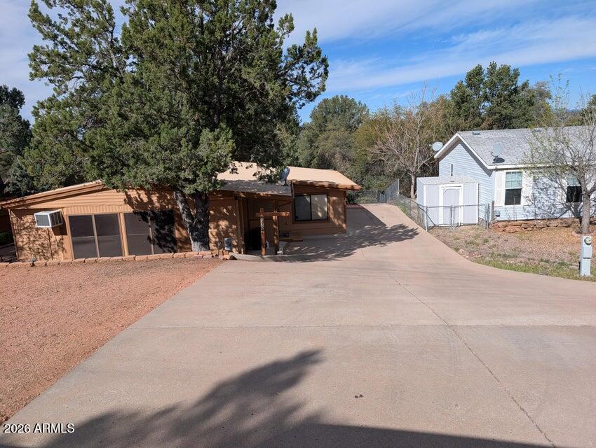 908 North Matterhorn Road Payson, AZ 85541 - Photo 49 of 59 a view of a house with a yard and large trees