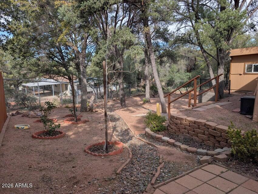 908 North Matterhorn Road Payson, AZ 85541 - Photo 53 of 59 a view of a backyard with table and chairs and potted plants