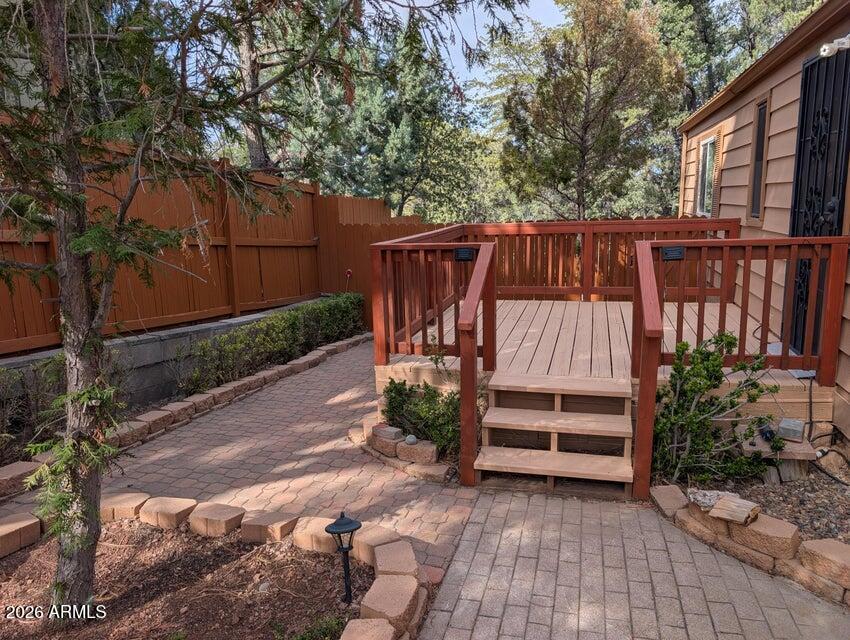 908 North Matterhorn Road Payson, AZ 85541 - Photo 9 of 59 a view of a backyard with wooden fence and a bench