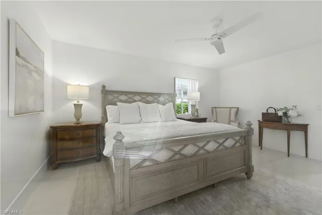 a bedroom with a bed and a table in it