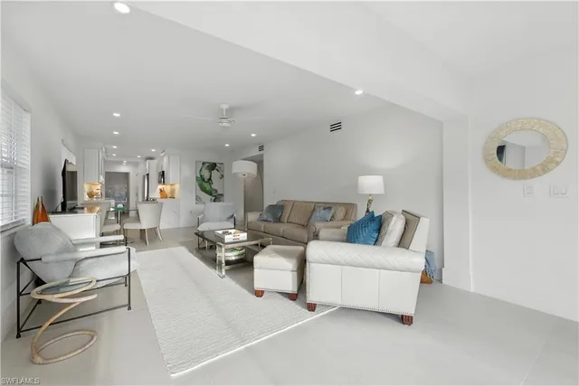 a living room with furniture and a night stand