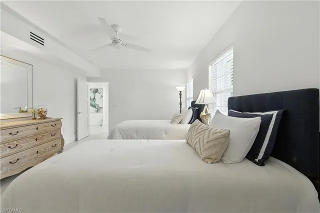 a bed room with a bed and a window