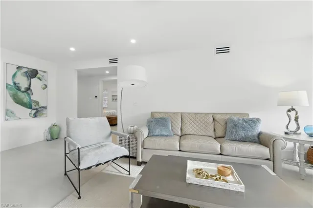 a living room with furniture and a couch