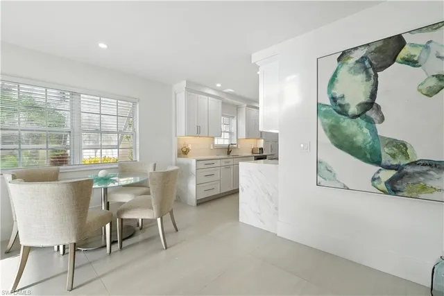 a kitchen with a table and chairs