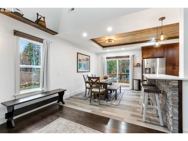 a kitchen with kitchen island granite countertop a stove and cabinets