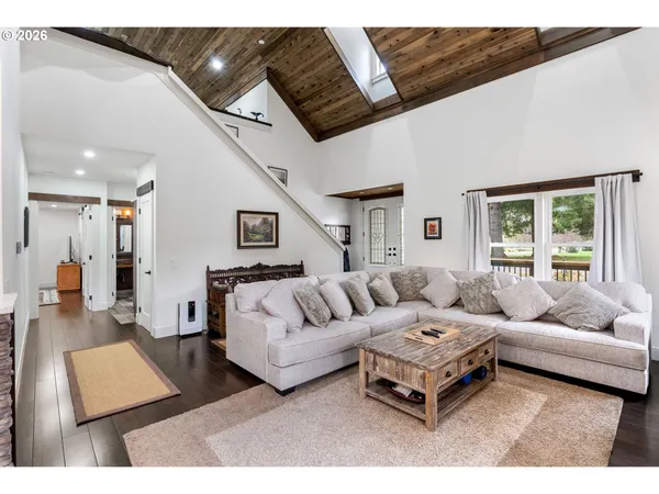 a living room with furniture fireplace and window