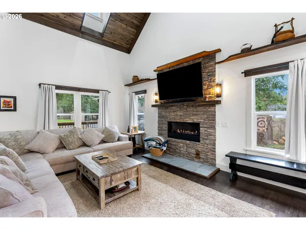 a living room with furniture a window and a table