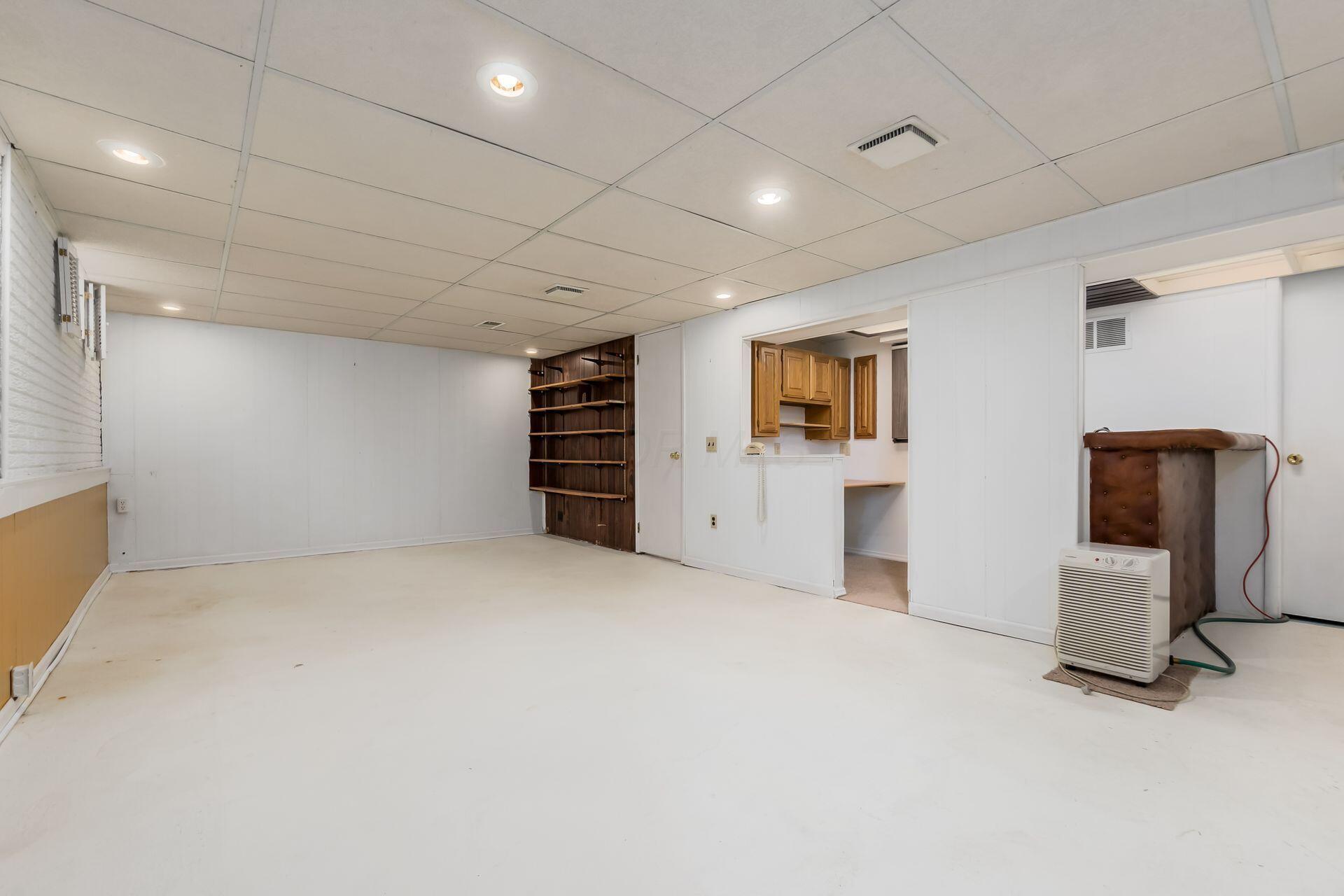 4765 Coach Road Columbus, OH 43220 - Photo 41 of 47 Open space is next to wet bar/desk and full bath/shower