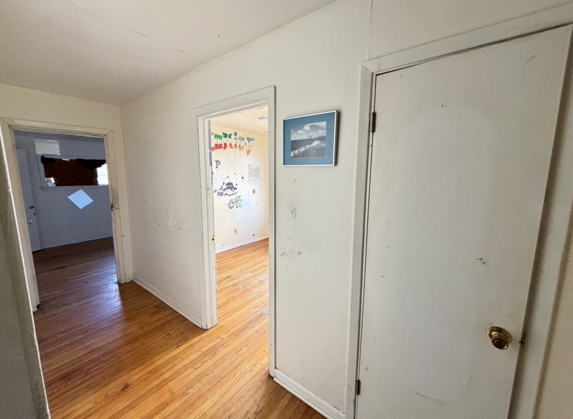 2208 Marshall Street Pasadena, TX 77506 - Photo 16 of 24 a view of a hallway with wooden floor and closet