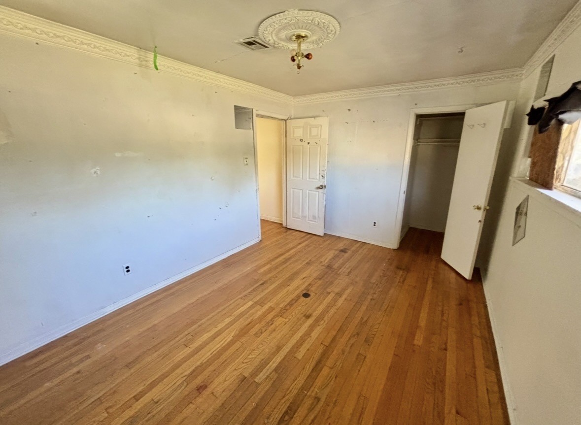 2208 Marshall Street Pasadena, TX 77506 - Photo 19 of 24 a view of empty room with wooden floor