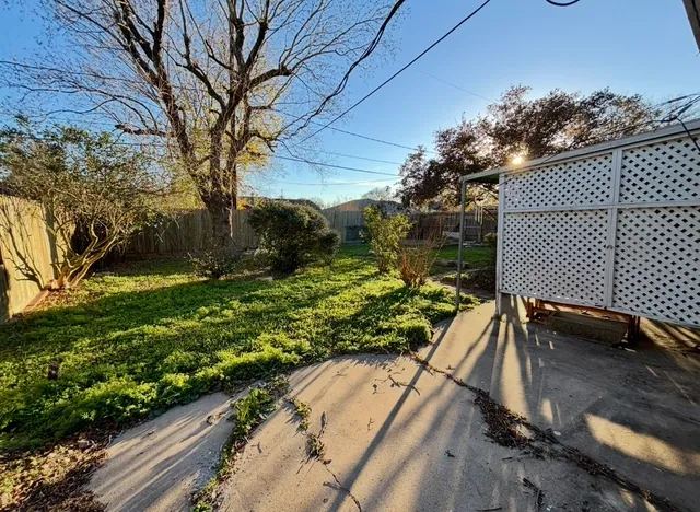 a backyard of a house with lots of green space