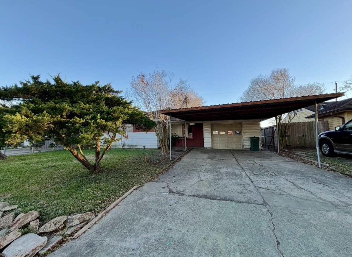 2208 Marshall Street Pasadena, TX 77506 - Photo 5 of 24 a view of a house with a yard and tree