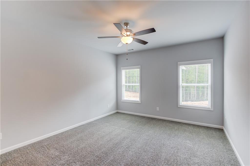 653 Dortch Road Eastanollee, GA 30538 - Photo 15 of 37 an empty room with a window and a fan