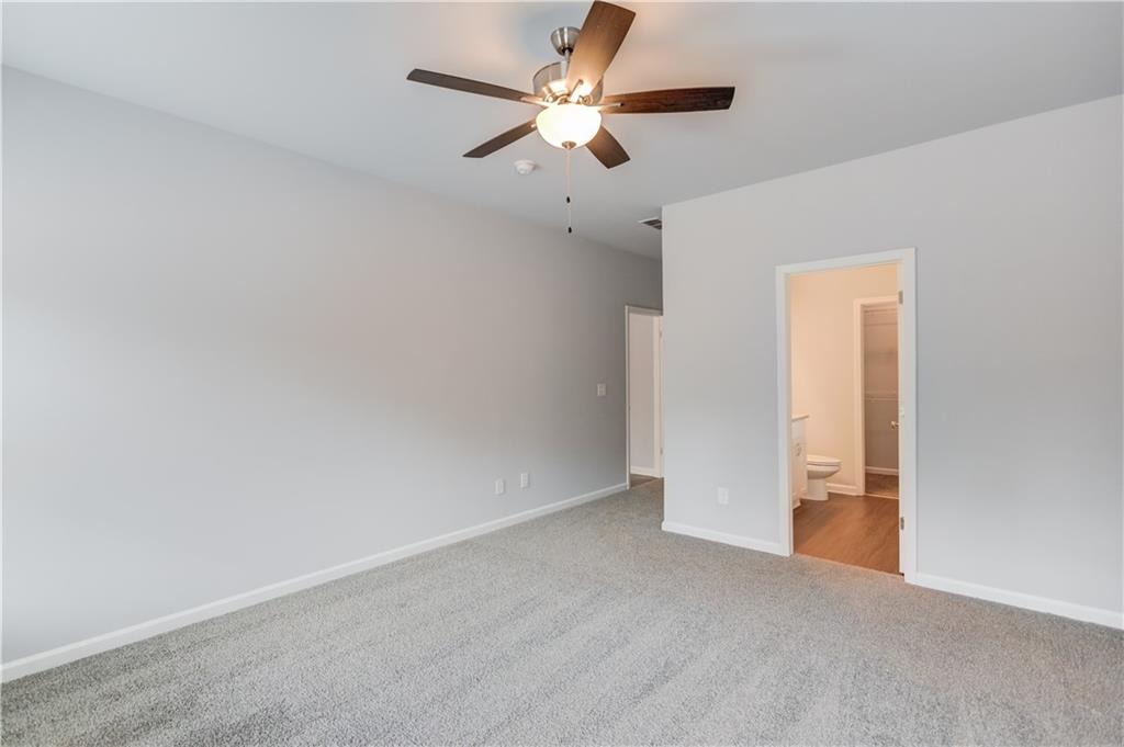 653 Dortch Road Eastanollee, GA 30538 - Photo 17 of 37 an empty room with chandelier fan