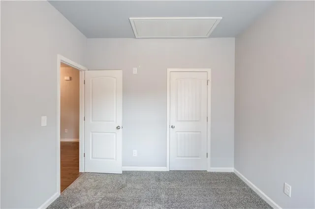 an empty room with closet area
