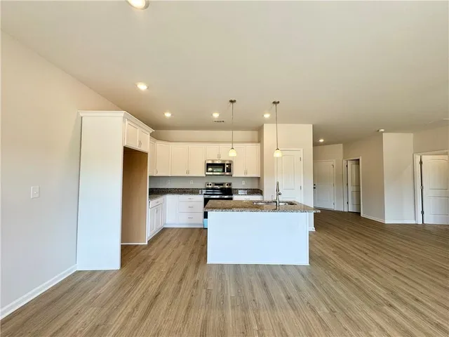 a view of kitchen with wooden floor