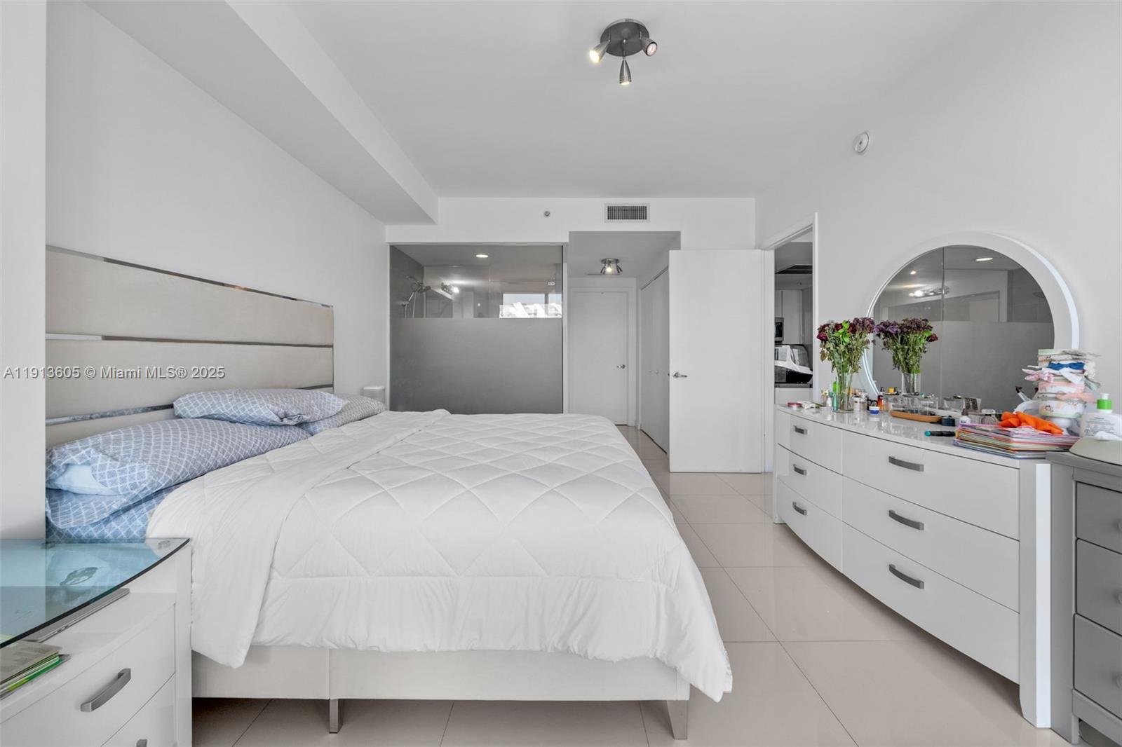 92 Southwest 3rd Street, Unit 4403 Miami, FL 33130 - Photo 14 of 28 a bedroom with a bed and a dresser